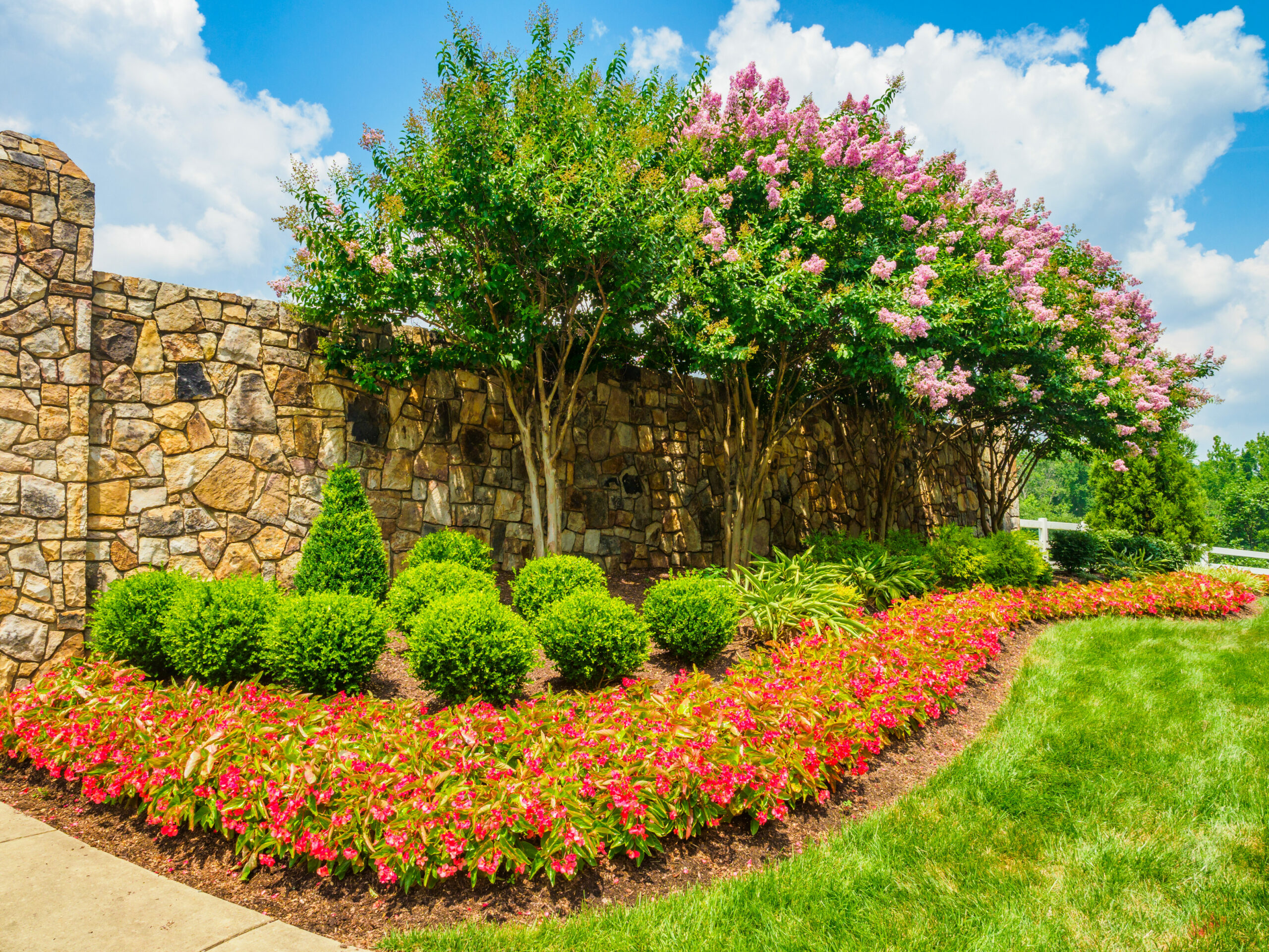 HOA with colorful landscaping and seasonal flowers.