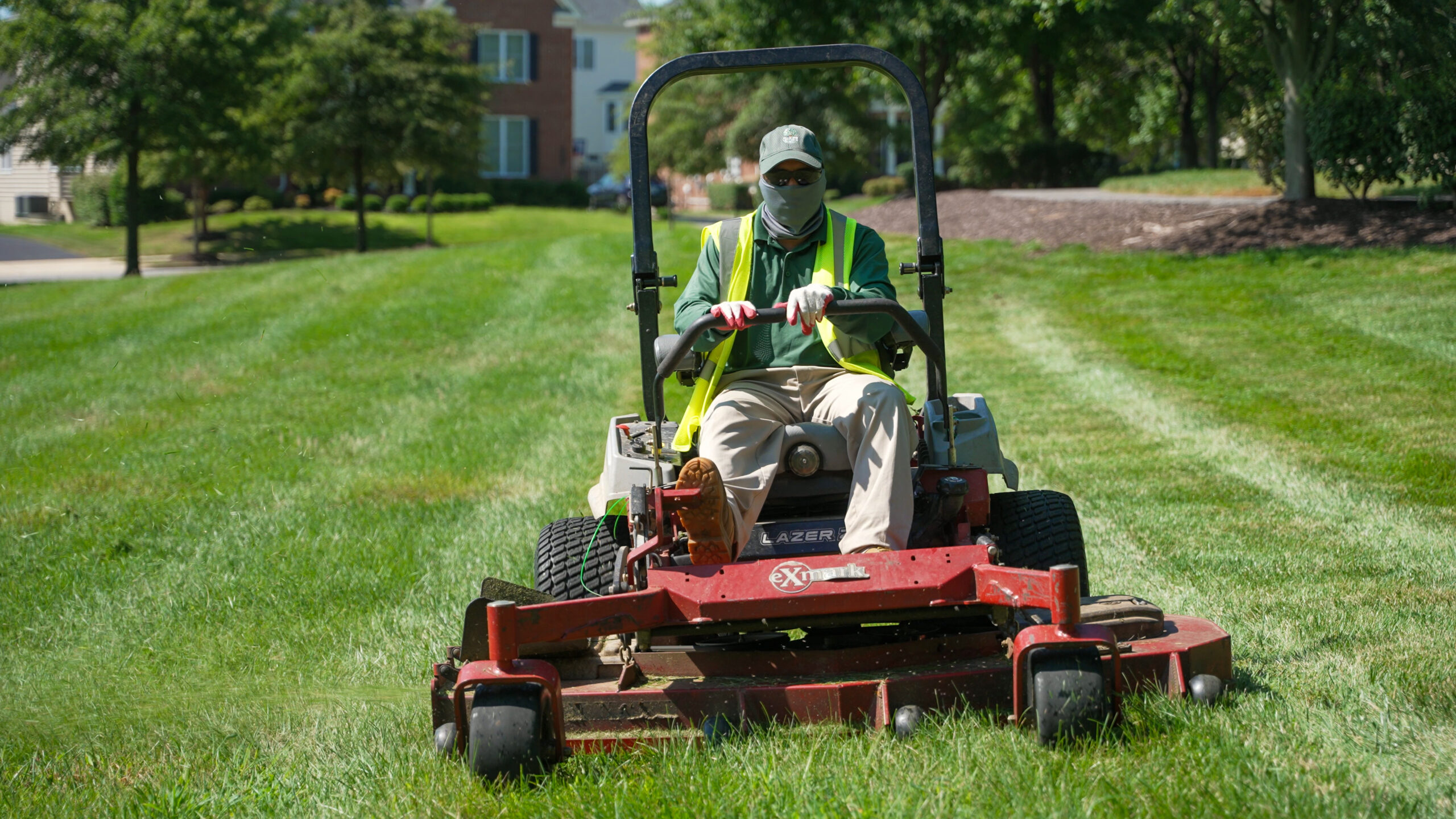 Crew member providing turf care and mowing services